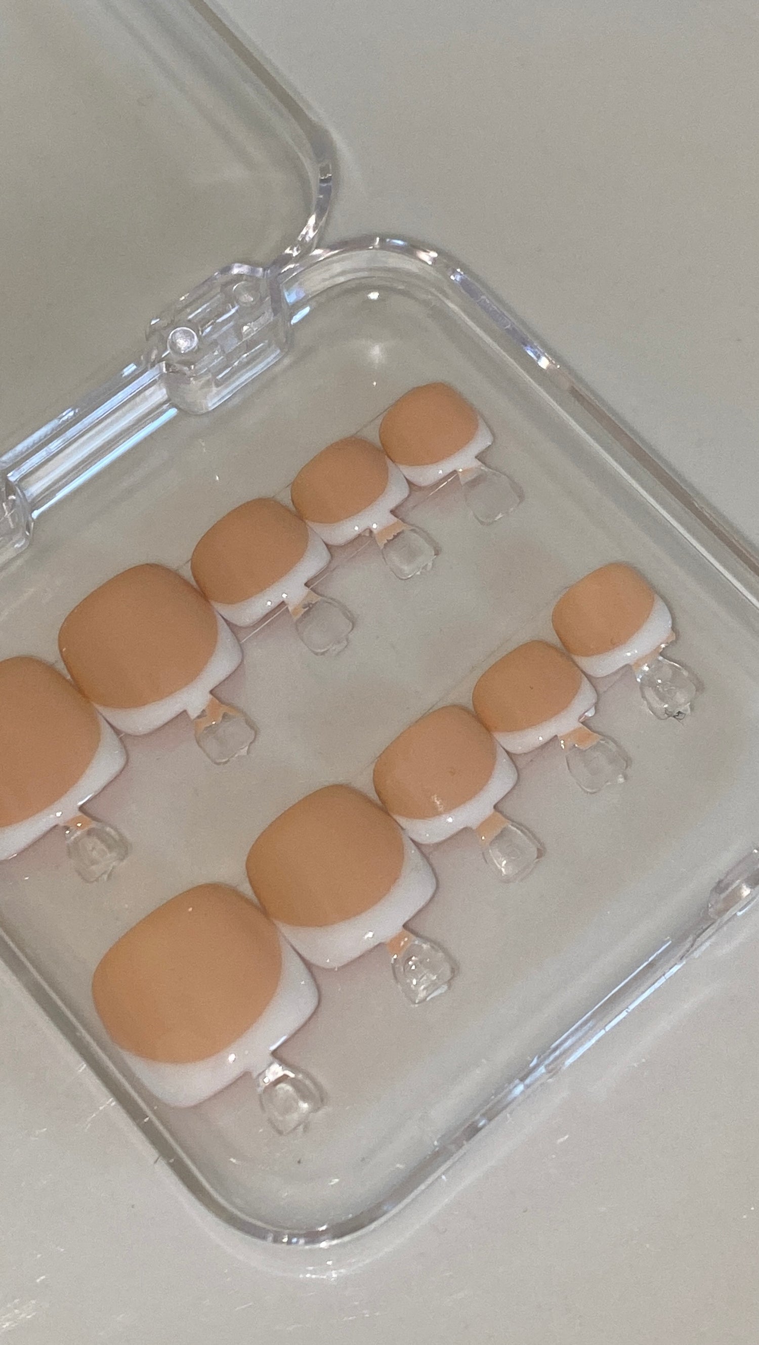 Nude base with white French tip toe pressons